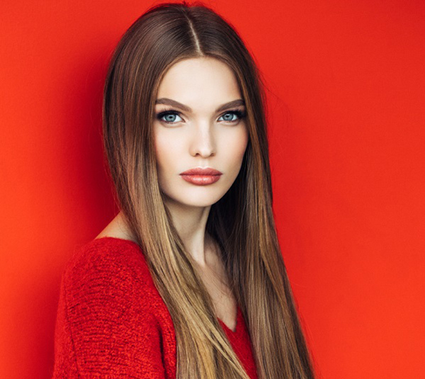 Young beautiful model with long straight hair